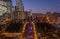 Parc Diderot with fountain stairs with street lights on and office buildings lights near La Defense financial district