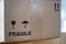 Parcel box with fragile warning symbol for shipping, transport