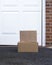 Parcel cardboard box in front door.Door to Door delivery of good merchandises while the quarantine,Delivered outside the door, e-