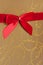 Parcel with gold paper and red ribbon