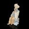 Parcel statuette of a young girl. porcelain antique girl figurine