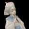 Parcel statuette of a young girl. porcelain antique girl figurine