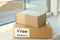 Parcels with sticker Free Delivery on window sill