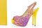 Pare of yellow women stiletto shoes with bag