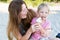 Parent and child eat ice cream, happy family moment