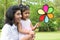 Parent and child playing windmill