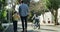 Parent, children and bicycle ride for girl, helmet and outdoor street with hand holding. Cycling, childhood and riding