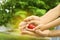 Parent and daughter holding heart in hands, closeup