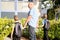 Parent, father, grandfather leads the children to school, sees them off, holds hands, the concept of accompanying schoolchildren,