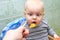Parent feeds baby a pumpkin with a spoon
