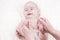 Parent holds gentle little beautiful feet in a newborn baby