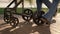 Parent legs carriage wheels rolling walkway closeup. Loving parenthood concept.