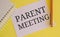 Parent Meeting text written on white paer with pen. Conceptual photo conference between the parents and teachers of students to