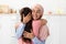 Parent& x27;s Affection. Happy Muslim Lady In Hijab Embracing Her Little Daughter, Closeup