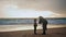 Parent scolding little boy on beach. Young mother talking boy resting shore