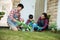 Parent and son gardening activity outdoor in the garden house