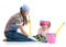 Parent teaches daughter child cleaning room