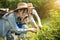 Parent teaching son about nature and plant