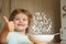 Parenthood. Little boy - ecology Food concept. Portrait of beautiful child having breakfast at home. Summer ration