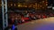 Parents awaits for his sons presentation in a old theatre