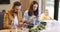 Parents busy in their phones during a lunch with their baby son