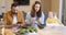 Parents busy in their phones during a lunch with their baby son