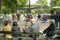 Parents and children at carousel ride in park, Paris, France