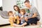 Parents and children playing guitar