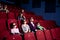 Parents with children watching a comedy