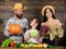 Parents and daughter celebrate harvest holiday pumpkin vegetables fruits. Harvest festival concept. Family farmers with