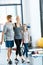 Parents and daughter with skipping ropes at health club