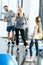 Parents and daughter with skipping ropes at health club