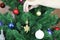 Parents dress up a festive tree for children