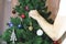 Parents dress up a festive tree for children