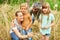 Parents exploring forest with kids during summer vacation