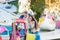 Parents at fun fair, waving their child taking ride