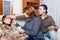 Parents giving medicinal sirup to boy