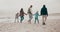 Parents, grandparents and children at beach with back, holding hands or adventure for connection on holiday. People