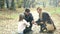 Parents having fun with daughter playing games in the park