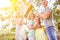 Parents hold a symbolical roof over their children as protection