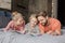 Parents lying on bed and looking at smiling daughter drawing