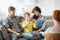 Parents and misbehaving boy during therapy session with counselor