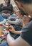 Parents playing with toddler a wooden game building