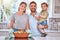 Parents portrait, dad with baby in kitchen and cooking chicken casserole in family home with smile. Happy mom, father