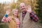 Parents saying bye bye to their children waving hands.