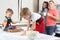 Parents see their young sons, who knead the dough on the kitchen table