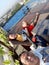 Parents take a picture together with two boys swimming in the poo