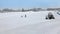 Parents teach child to ski on skiing downhill at ski resort