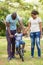 Parents teaching son bicycle