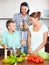 Parents and teenager cooking together